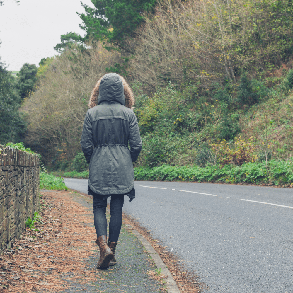 person walking down the street in fall