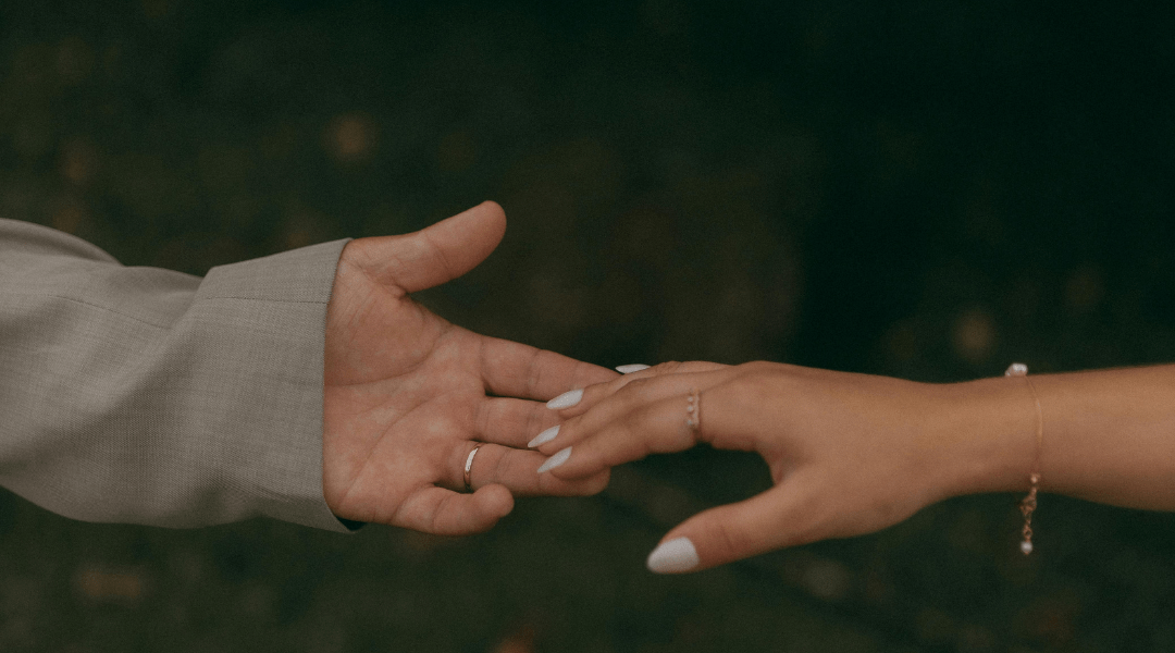 hands reaching for eachother