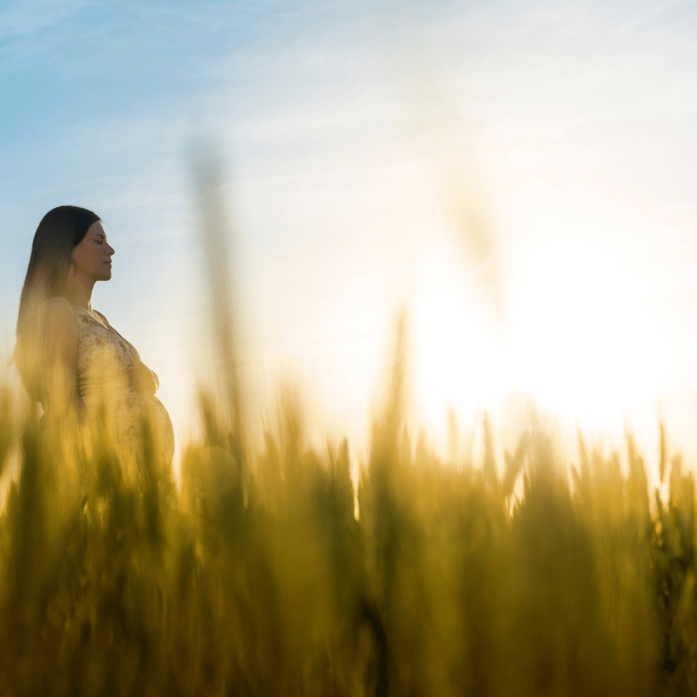 woman in tall grass field 