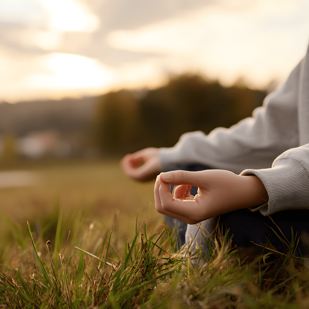 person reflecting in an open field