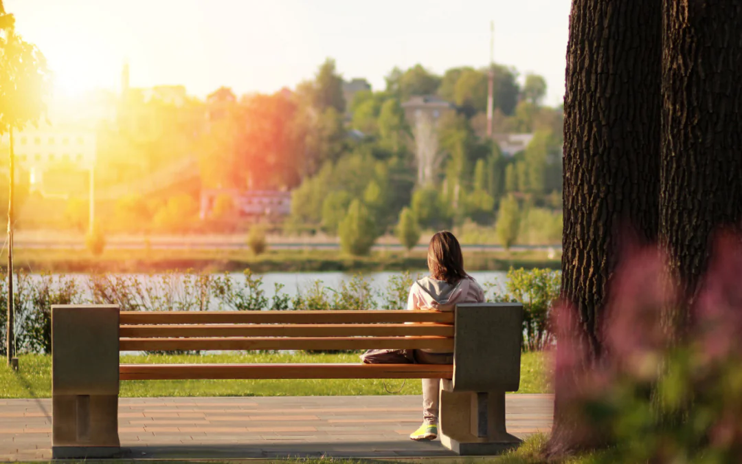 Person sitting on a park bench